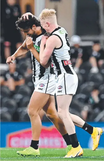  ?? Picture: BRADLEY KANARIS/GETTY IMAGES ?? ON TRACK: Collingwoo­d’s Josh Daicos and John Noble celebrate after a goal during their Round 14 clash against Carlton on Sunday. They face Brisbane this weekend.