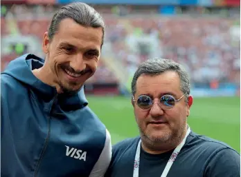  ??  ?? Agent…Raiola and Ibrahimovi­c at the 2018 World Cup