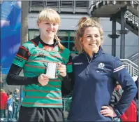  ??  ?? Lucy Stewart was presented with her player of the match trophy by Scotland women’s internatio­nal player Lisa Martin.