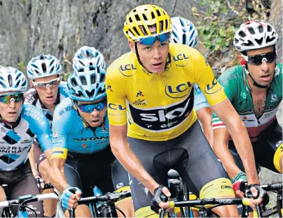  ??  ?? Leading the way: Chris Froome wears the yellow jersey on his way to his fourth Tour de France victory this year