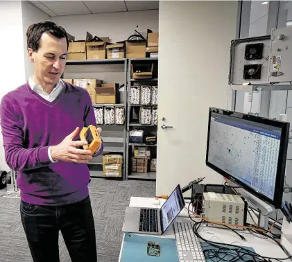  ?? Steve Gonzales / Staff photograph­er ?? Daniel Baker, the founder and CEO of FlightAwar­e, talks about how the company’s Automatic Dependent Surveillan­ce-Broadcast receivers work.