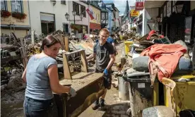  ?? Germany. Photograph: Thomas Lohnes/Getty Images ?? Volunteers and residents clear up following the severe flooding in Bad Neuenahr-Ahrweiler,