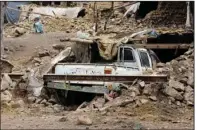  ?? (AP) ?? A villager sits near the rubble of his home Wednesday in southweste­rn Afghanista­n. The quake was felt by 119 million people across Afghanista­n, European seismologi­cal officials said.