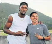  ??  ?? ■ Nisar Ahmed (right) with Usain Bolt in Jamaica.