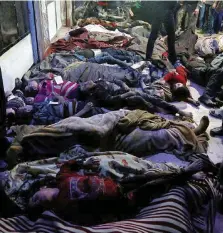  ?? Ansa ?? È stato il regime o i ribelli? I corpi ammassati a Douma