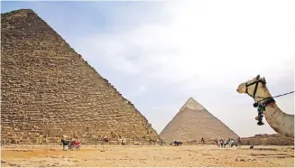  ??  ?? The Great Pyramid, left, is the only standing monument of the Seven Wonders of the Ancient World.