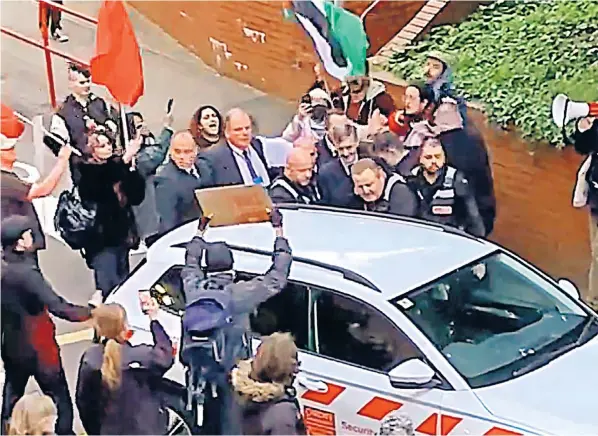  ?? ?? Footage shows Jacob Rees-Mogg being surrounded by protesters at Cardiff University who shouted ‘Tory c--t’ and ‘shame on you’ at the MP