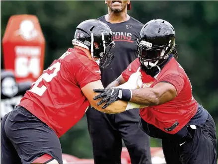  ?? CURTIS COMPTON / CCOMPTON@AJC.COM ?? Falcons defensive tackle Terrell McClain (right) faces off against Justin Zimmer. McClain is a lock to make the roster while Zimmer is on the bubble. Of Thursday’s game, Zimmer says: “I’m just going out there and try to put my best game on tape.”