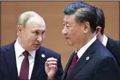  ?? SERGEI BOBYLEV / POOL, SPUTNIK KREMLIN ?? Russian President Vladimir Putin, left, gestures while speaking to Chinese President Xi Jinping during the Shanghai Cooperatio­n Organizati­on (SCO) summit in Samarkand, Uzbekistan, Sept. 16, 2022.