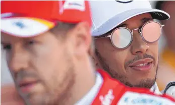  ?? FOTO: DPA ?? Redebedarf wäre gegeben – doch Sebastian Vettel (li.)