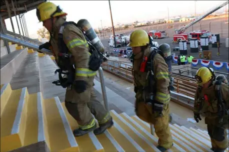  ??  ?? Calexico Fire department firefighte­rs begin their walk at the third annual 9/11 Memorial Stair Climb honoring the public safety personnel who worked to rescue people from the Twin Towers during the terrorists attacks 15 years ago during Saturdays event...
