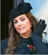  ?? AP ?? Queen Elizabeth and Kate, the Duchess of Cambridge, listen during the service of remembranc­e at the Cenotaph in Whitehall, London, on Sunday. —