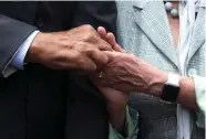  ??  ?? John Lewis holds hands with House Minority Leader Nancy Pelosi as they sing “We Shall Overcome” on Capitol Hill in Washington on Thursday.