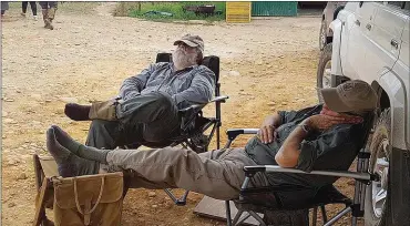  ??  ?? Totally buggered! Kobus (left) and Chris Marshall taking a well-earned break during the 2018 HPR trials event. Photo: Dante Fratti.