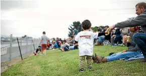  ??  ?? Visitors can enjoy the action trackside or walk the pits to get to know the drivers and see their cars up close.