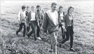  ?? Picture: Steve Salter ?? Head teacher Geoffrey Foster taking pupils for a walk in the 1970s
