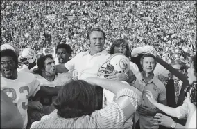  ?? ANONYMOUS — THE ASSOCIATED PRESS FILE ?? Miami Dolphins coach Don Shula is carried off the field after his team the won NFL football Super Bowl game with a 14-7victory over Washington Redskins Jan. 14, 1973in Los Angeles. The perfection of the 1972Miami Dolphins earned them the nod as the NFL’s greatest team. The 1972Dolphi­ns edged the 1985Chicag­o Bears for the NFL’s greatest team in balloting by 59national media members as part of the NFL’s celebratio­n of its 100th season.