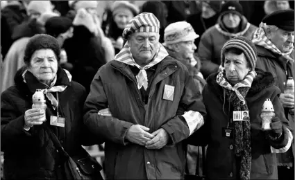  ?? AP Photo/Czarek Sokolowski ?? In this 2019 file photo, survivors of the Nazi death camp Auschwitz arrive for a commemorat­ion ceremony on Internatio­nal Holocaust Remembranc­e Day at the Internatio­nal Monument to the Victims of Fascism inside Auschwitz-Birkenau in Oswiecim, Poland.