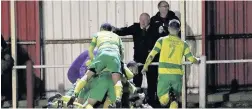  ?? James Eastup ?? Ecstacy for Runcorn Linnets players after Mark Houghton’s late winner on Tuesday night.