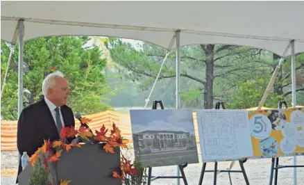  ?? ABIGAIL WARREN ?? Bob May, Avenida Partners LLC founder, speaks to a small crowd. Avenida broke ground in Germantown Thursday.