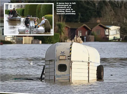  ??  ?? A horse box is left submerged as residents of a caravan park in Yalding, Kent, are rescued yesterday