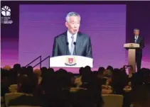  ?? – AFP ?? MAKING A POINT: Singapore’s Prime Minister Lee Hsien Loong speaks at a business forum on the sidelines of the 33rd Associatio­n of Southeast Asian Nations (Asean) summit in Singapore on Monday.