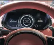  ?? PHOTO: BLOOMBERG ?? A digital dashboard display sits behind the steering wheel of an Aston Martin V8 Vantage luxury car, but a glimpse behind the dashboard may reveal a mess.