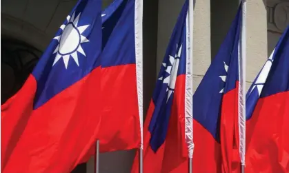  ?? Photograph: Ann Wang/Reuters ?? Taiwan flags flutter in Taipei. China claims Taiwan as its territory under its ‘one-China principle’, which Canada formally endorses while maintainin­g unofficial ties.