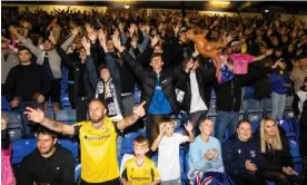  ?? Antonio Olmos/The Guardian ?? Southend United fans celebrate during the win against Oxford City after being rescued by a last minute bid to buy the club. Photograph: