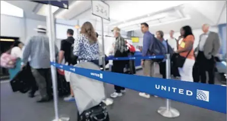  ?? M. Spencer Green
Associated Press ?? UNITED AIRLINES
will allow families with children age 2 or younger to board before other passengers starting Feb. 15.