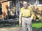  ?? RICHARD SENNOTT / STAR TRIBUNE 2014 ?? Michael Karkoc, now 98, works in his yard in Minneapoli­s in 2014. Karkoc was a commander of a unit accused of burning villages and killing civilians in Poland, a Polish prosecutor alleges.