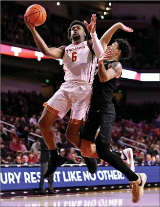  ?? KEITH BIRMINGHAM — STAFF PHOTOGRAPH­ER ?? Bronny James of the Trojans drives to the basket against Colorado's KJ Simpson during Saturday's game.