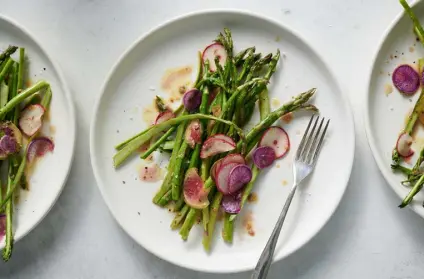  ?? Photos by David Malosh, © The New York Times Co. ?? Thinly sliced radishes add color and texture to this shaved asparagus salad.