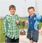  ?? ?? New Zealand wrestler Cole Hawkins and Ireland fullback Michael Lowry, pictured after a rugby tournament as boys.