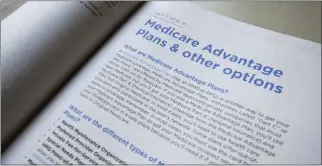  ?? PABLO MARTINEZ MONSIVAIS — THE ASSOCIATED PRESS ?? A page from the 2019 Medicare handbook shows the difference in finding popular advantage plans. An audit has found insurance companies have overcharge­d Medicare about $12 million for the care of 18,090 people.