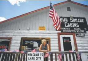  ?? The Denver Post RJ Sangosti, ?? Tina Burian and her husband have owned Town Square Cabins and convenienc­e store in Lake City for 10 years. In southweste­rn Colorado, many of the towns where the mines have closed are trying to make new economies out of tourism.