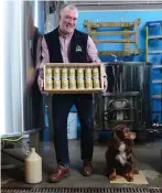  ??  ?? Mark Hazell, owner of Jaw Brew Beer, with his cocker spaniel Libby