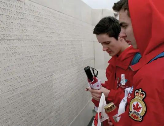  ??  ?? Students in 2012 search the walls of the Vimy Memorial for the names of the Canadian soldiers they researched as part of a school project.