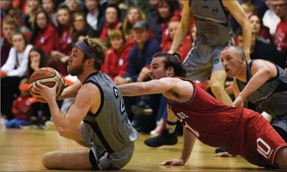  ??  ?? Darragh O’Hanlon of Garvey’s Warriors Tralee in action against Stephen James of Templeogue during the Hula Hoops Pat Duffy Men’s National Cup match between Templeogue and Garvey’s Warriors Tralee at Oblate Hall in Inchicore, Dublin. Photo by Sportsfile