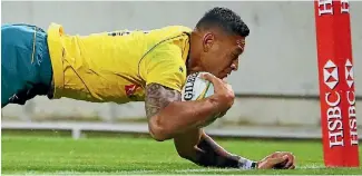  ?? PHOTO: GETTY IMAGES ?? Israel Folau dives to score his second try during the Wallabies’ win.