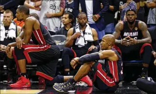  ?? ANDY LYONS / GETTY IMAGES ?? Chris Bosh (from left), Dwyane Wade, Ray Allen and LeBron James produced NBA titles, but Allen says a tough schedule and too many practices wore out the veterans in 2013-14.