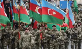  ?? Photograph: Valery Sharifulin/Tass ?? Azerbaijan­i servicemen at a military parade marking the end of the Nagorno-Karabakh military conflict.