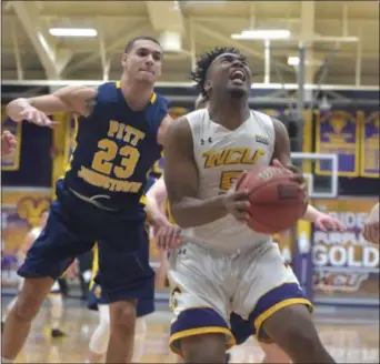  ?? PETE BANNAN — MEDIANEWS GROUP ?? West Chester University’s Evan-Eric Longino shoots in the first half against University of Pittsburgh­Johnstown Wednesday evening.