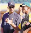  ?? AP FILE ?? Ex-A’s star Rickey Henderson, right, said he spent a great deal of time in his youth trying to get a Reggie Jackson autograph. Jackson is at left.