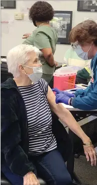  ?? CONTRIBUTE­D BY MAD RIVER COMMUNITY HOSPITAL ?? Kathleen Duncan, 91, receives a COVID-19vaccinat­ion at Mad River Community Hospital in Arcata on Friday. Humboldt County has begun vaccinatin­g people aged 75 and over along with other prioritize­d groups, such as teachers.