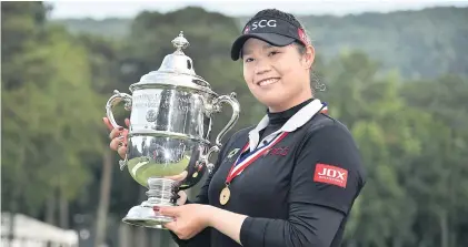  ?? USA TODAY SPORTS ?? Thailand’s Ariya Jutanugarn holds the trophy after winning the US Women’s Open in 2018.