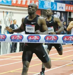  ?? KATHY KMONICEK/AP ?? LaShawn Merritt wins the men’s 500-meter dash at the Millrose Games in New York in February 2012. Merritt is part of the Virginia Sports Hall of Fame’s 2024 class.