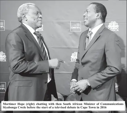  ?? ?? Mortimer Hope (right) chatting with then South African Minister of Communicat­ions Siyabonga Cwele before the start of a televised debate in Cape Town in 2016
