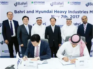  ??  ?? Bahri officials sign a MoU with Hyundai at Bahri’s headquarte­rs in Riyadh.