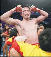  ?? Al Bello Getty Images ?? SRISAKET SOR RUNGVISAI, the WBC superf lyweight champion, is revered in Thailand.